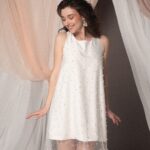 Abito da sposa corto Camille Perle in crêpe cady con tulle ricamato a perline, linea svasata e stile fresco